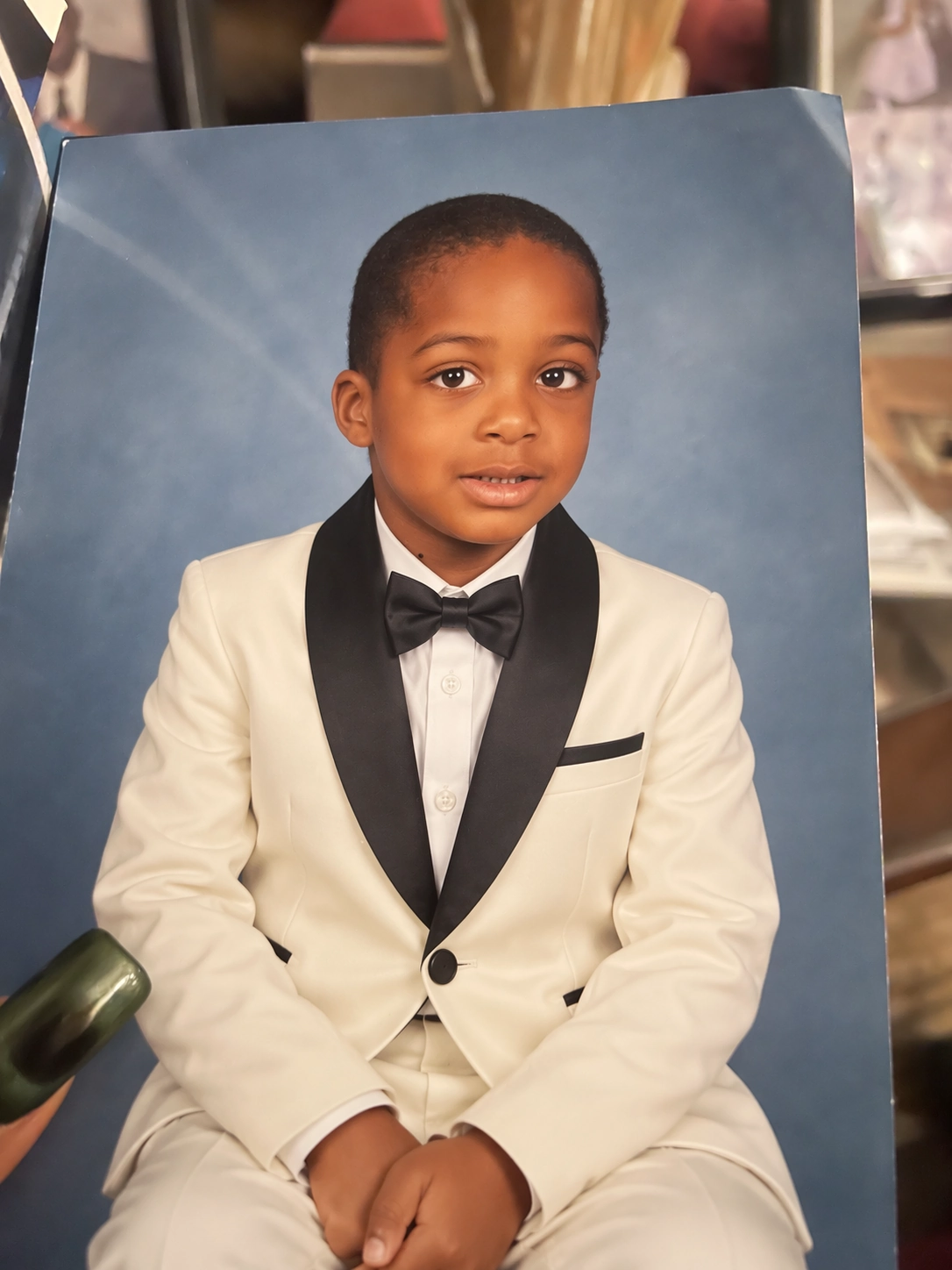 Official output: the portrait edited to show an ivory tuxedo and black bow tie