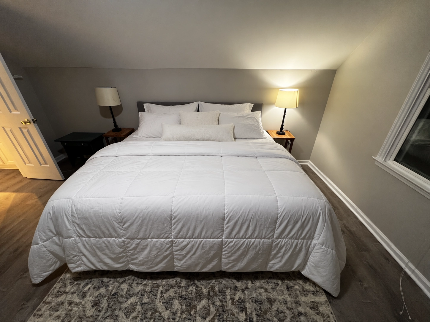 Official output: the bed made, with straightened bedding and arranged pillows
